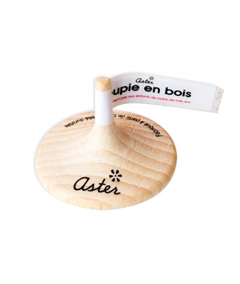 Personalized wooden spinning top with customizable label, made for the brand Aster
