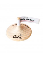 Personalized wooden spinning top with customizable label, made for the brand Aster